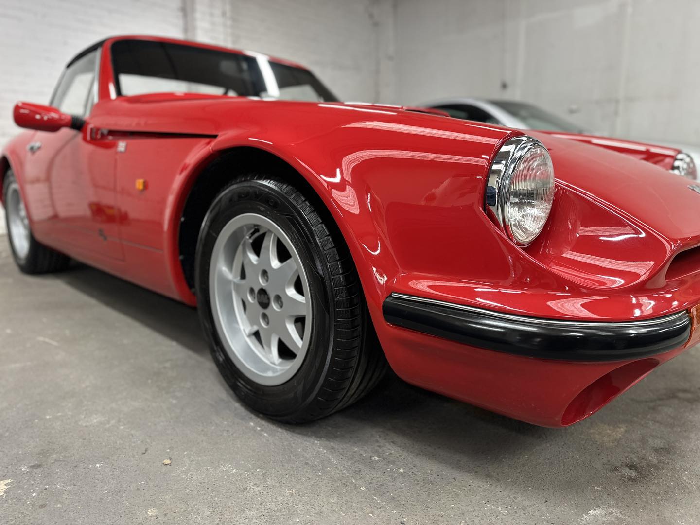 An image of restored paintwork on a classic car